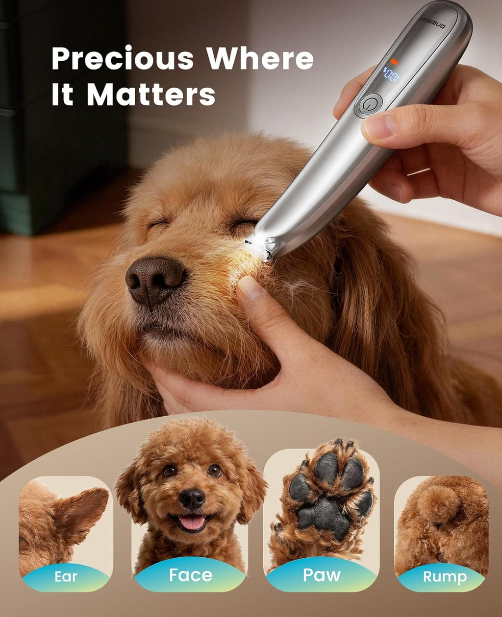 Silver pet hair clipper with built-in LED light illuminating dog paw pads.