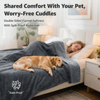 Reversible leakproof love blanket spread over a twin size bed mattress