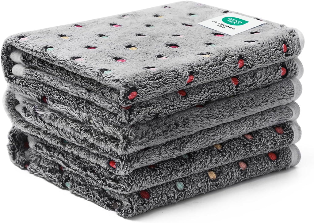 Luciphia machine washable pet blankets being folded after a fresh laundry cycle