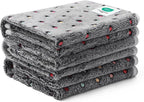Luciphia machine washable pet blankets being folded after a fresh laundry cycle