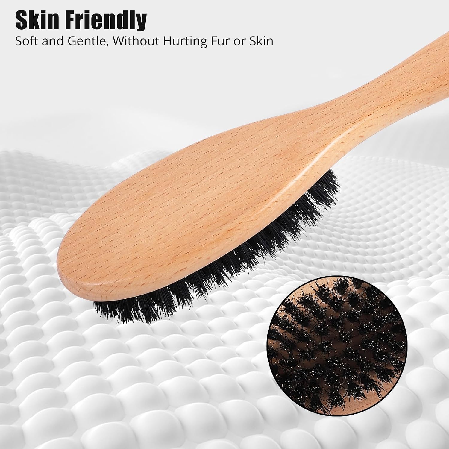 Myselect wooden handle brush being used gently to groom a short haired kitten.