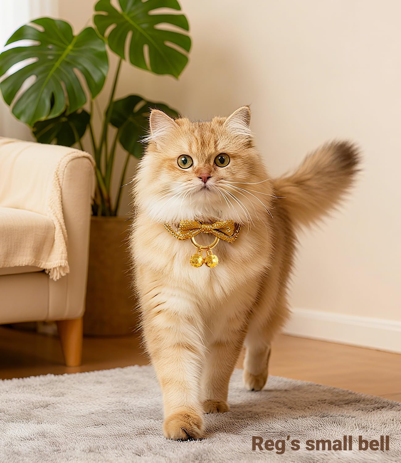 Pair of premium gold cat bells showing intricate decorative pattern detailing