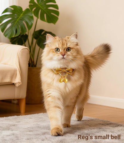 Pair of premium gold cat bells showing intricate decorative pattern detailing