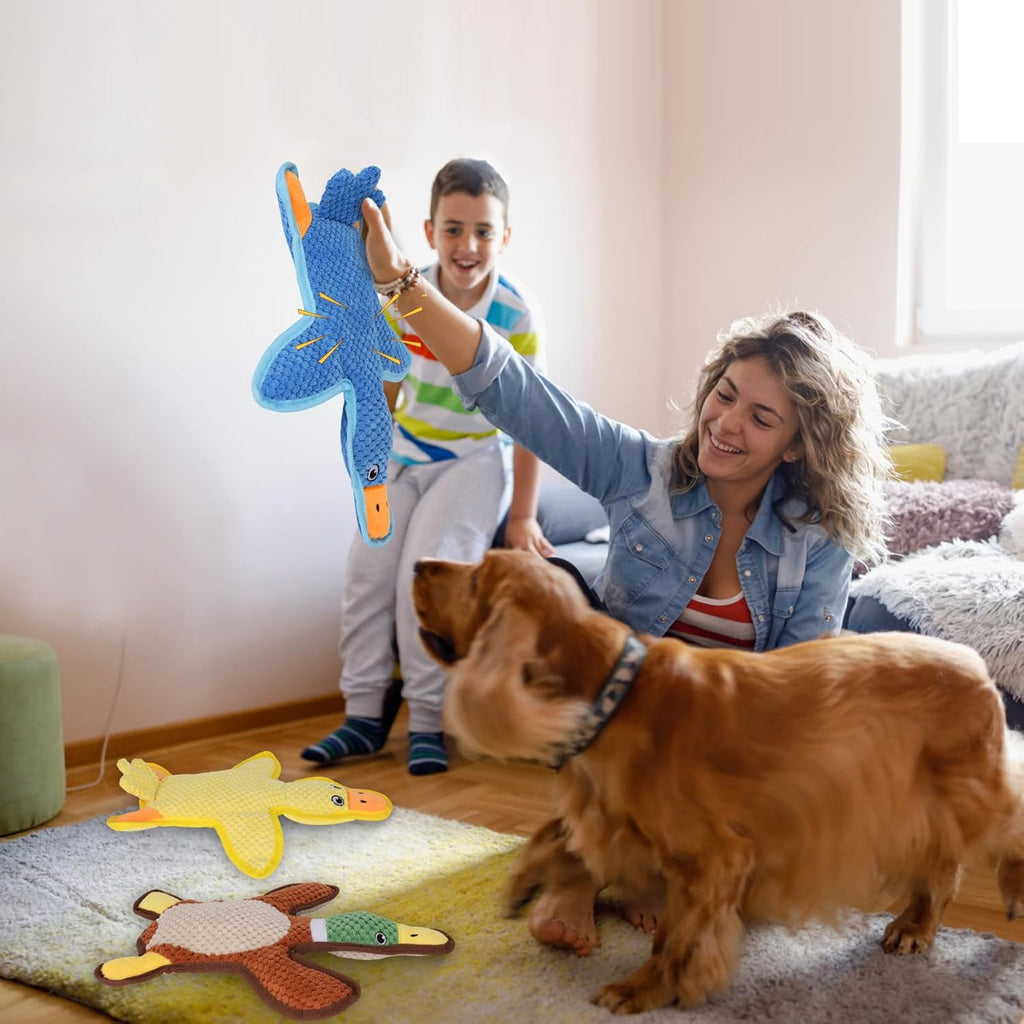 Squeaking and crinkling puppy play toys set on flat surface