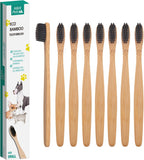 Hand holding H&H Pets bamboo toothbrush for size reference