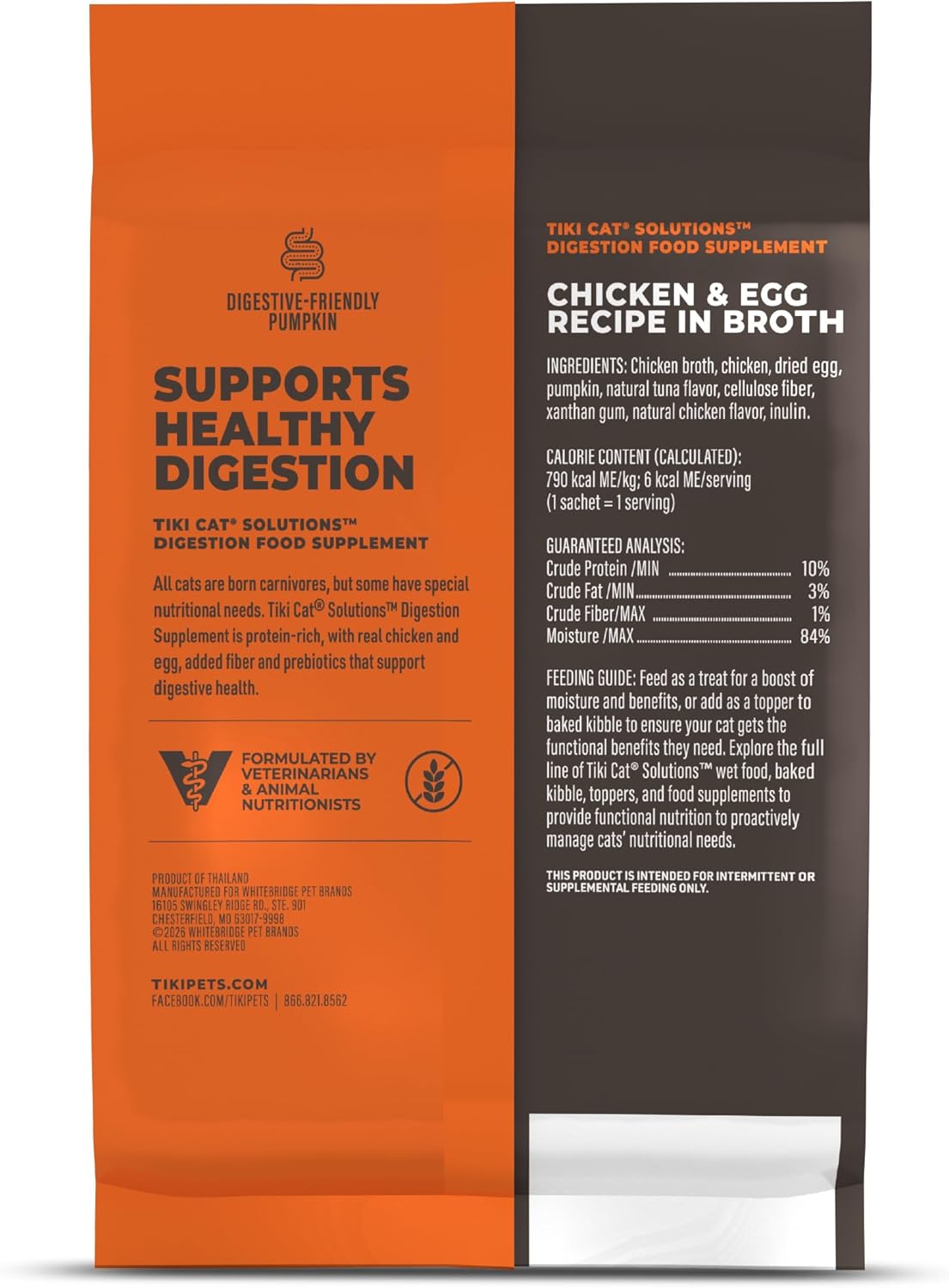 Feline digestive health wet supplement puree being squeezed onto dry cat kibble.