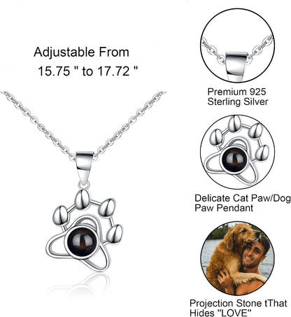 Close up view of the hidden photo micro lens inside the sterling silver paw pendant.