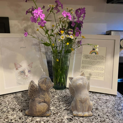 Three inch gray cat memorial figurine displayed on a wooden living room shelf
