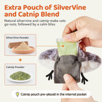 Adult cat kicking and biting the touch-activated electronic bird kicker toy.