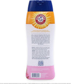 Dog enjoying a bath with Arm and Hammer deodorizing shampoo