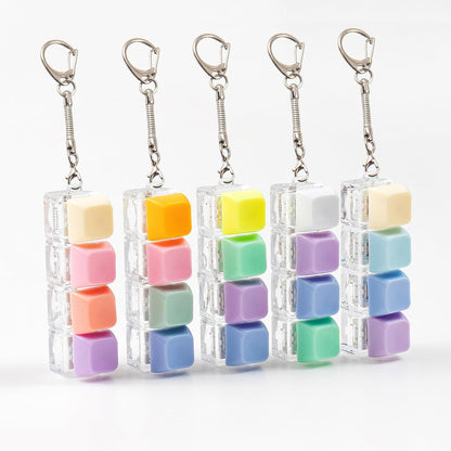 Gliging mechanical keyboard fidget toy keychain pack front view showcasing colorful pastel keycaps and clear housings.