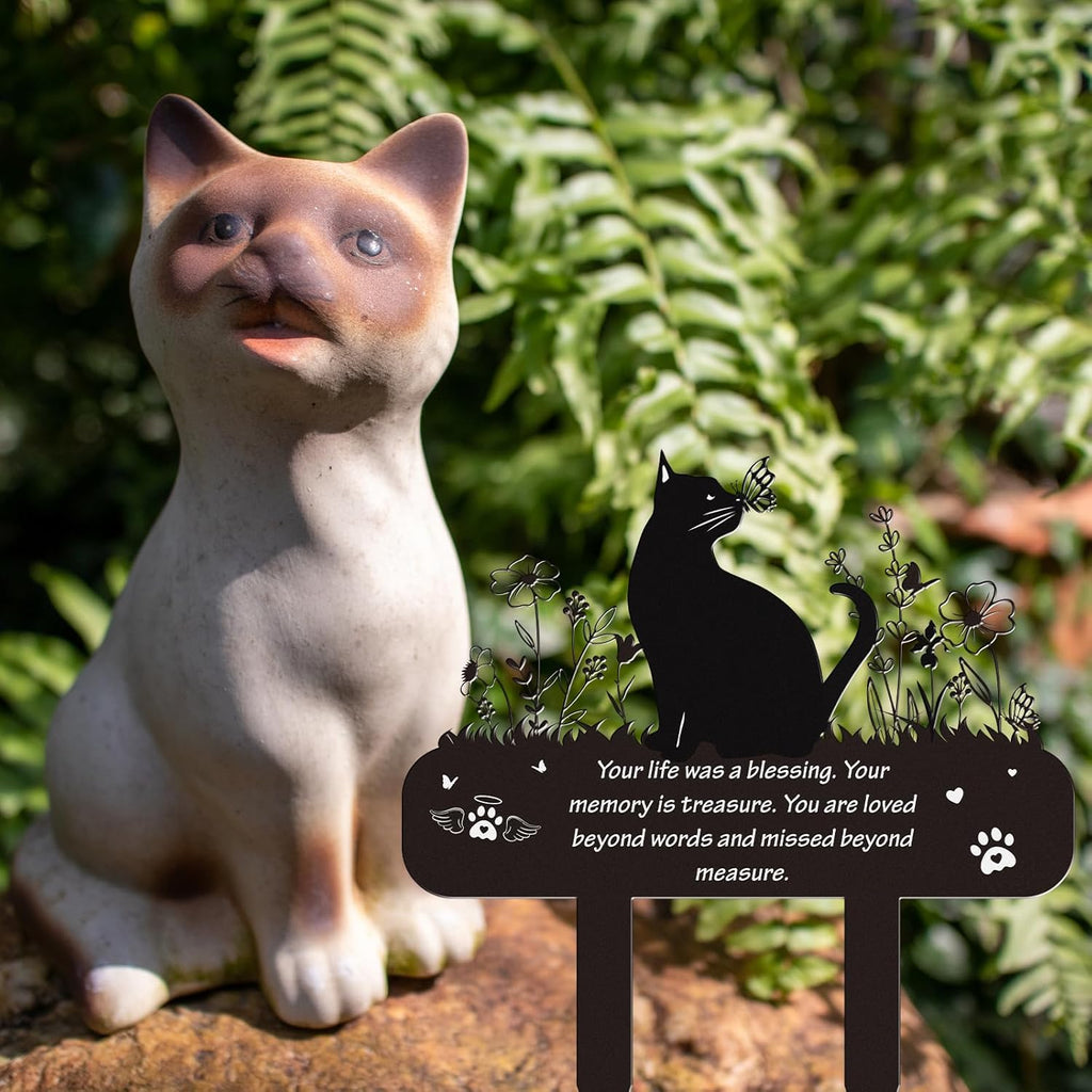 Laser cut kitten memorial garden ornament standing in flower bed