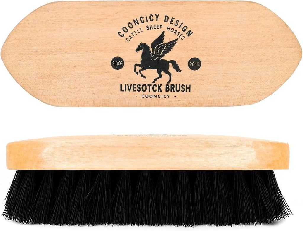 Natural wood handle livestock brush with hand strap for secure grip.