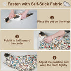 Washable pet grooming blanket being used for stress free feline ear cleaning.
