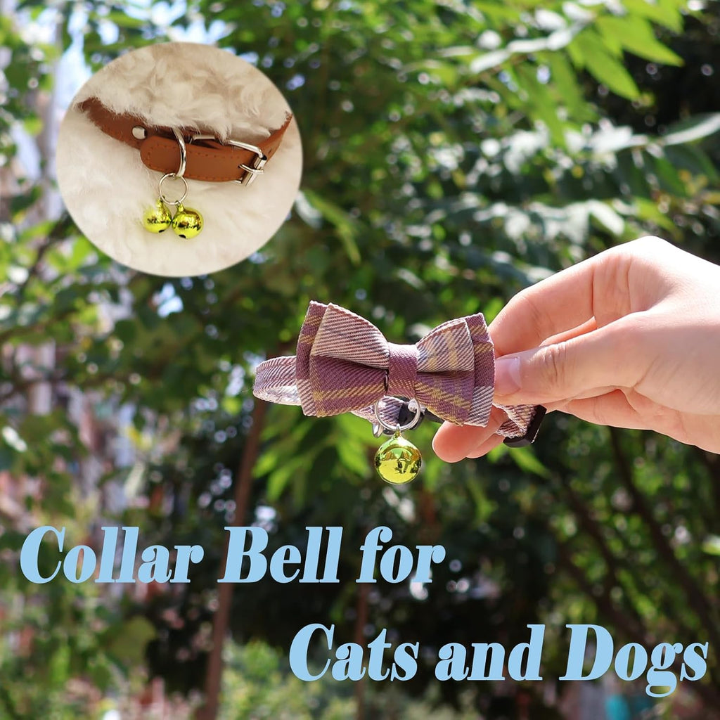 Four green copper pet bells with stainless steel split rings for secure collar attachment