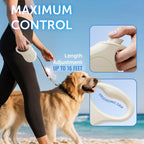 Small dog walking with cream TUG Quest retractable leash