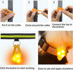 Orange circular LED pet safety light illuminating up to one thousand feet