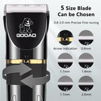 Gooad cordless paw trimmer being used gently on a long haired cat.