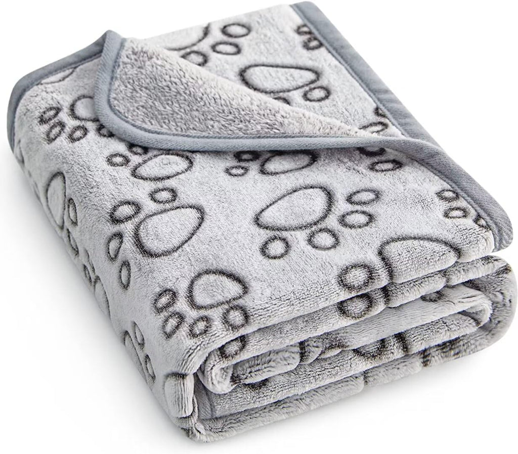 Stuffed premium soft dog blanket front view showing grey paw print design