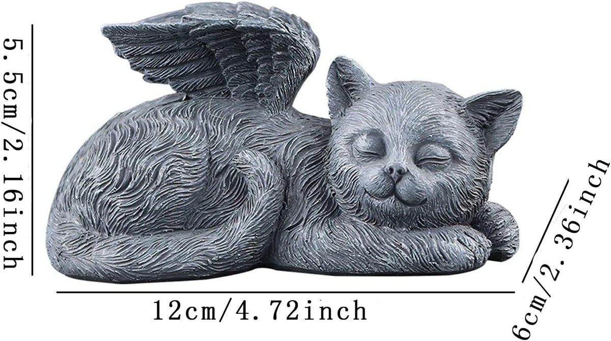 Resin angel cat grave marker placed in a green garden setting.