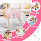 Dog wearing pink post-surgery onesie for wound protection