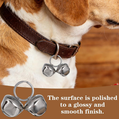 Qpets silver jingle bells being attached to a pet collar hook.