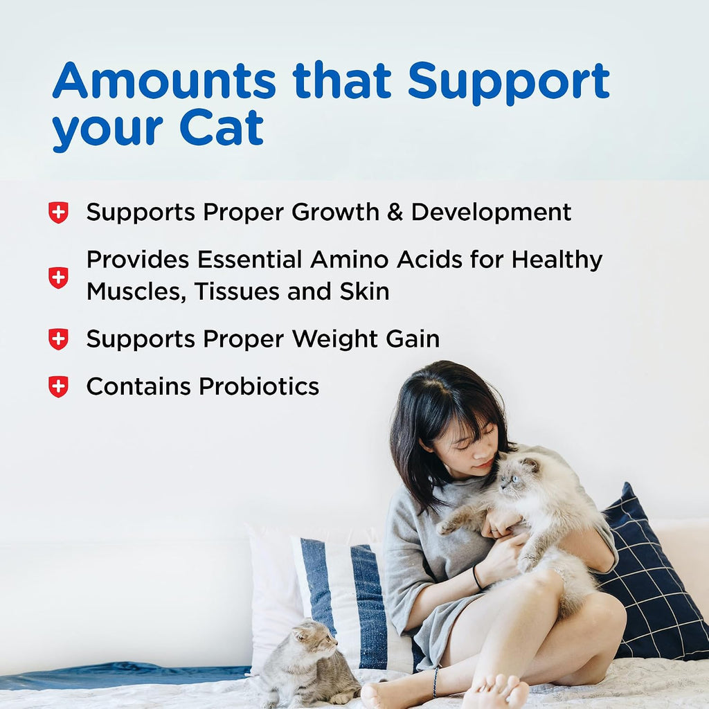Healthy cat nursing with milk replacer product container beside