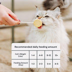 Nutritious grain free cat food topper being crumbled over a regular feline meal bowl.