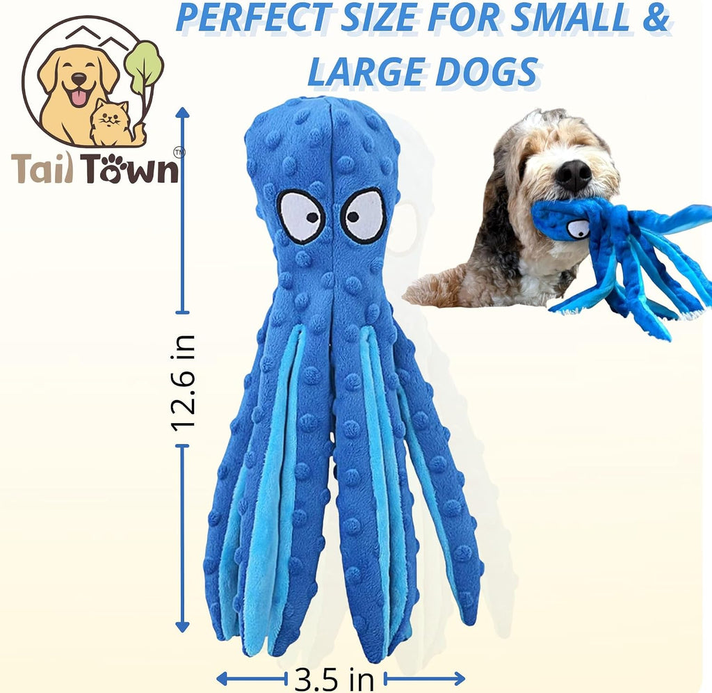 Small dog playing with blue octopus interactive toy