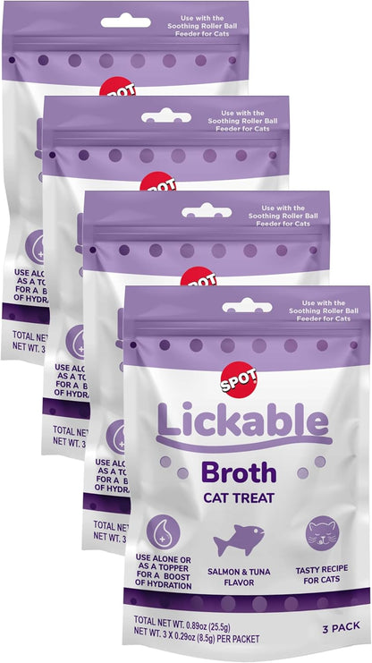 Three tubes of Spot salmon and tuna cat broth treats on display