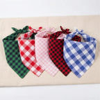 Durable stitched pink plaid dog apparel flat lay view on a white background.