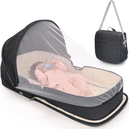 YVMVDV Portable Travel Bassinet front view showing the protective black fabric design and cozy internal mattress.