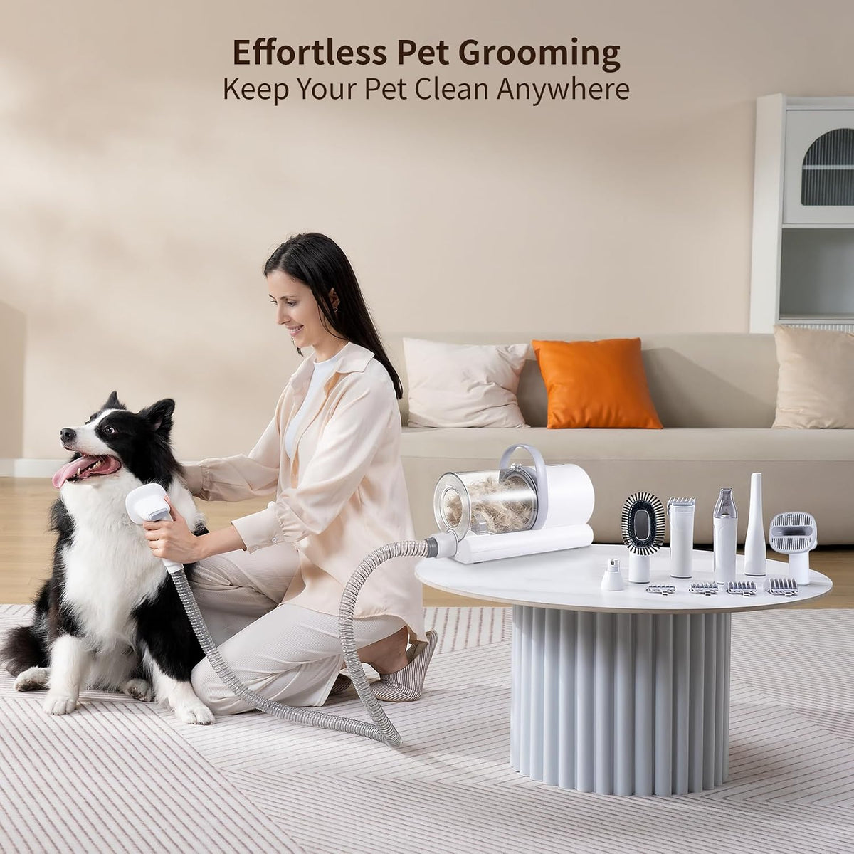 Low noise electric pet clippers attached to the powerful grooming suction hose