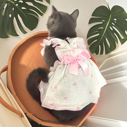 AXIIJGL female pet clothes back view highlighting the large satin bow decor