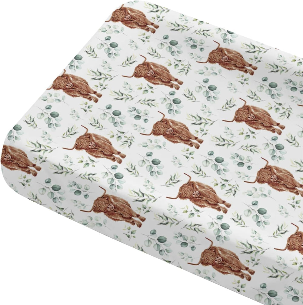 Tewrnvioc changing pad cover front view showing highland cow and eucalyptus print