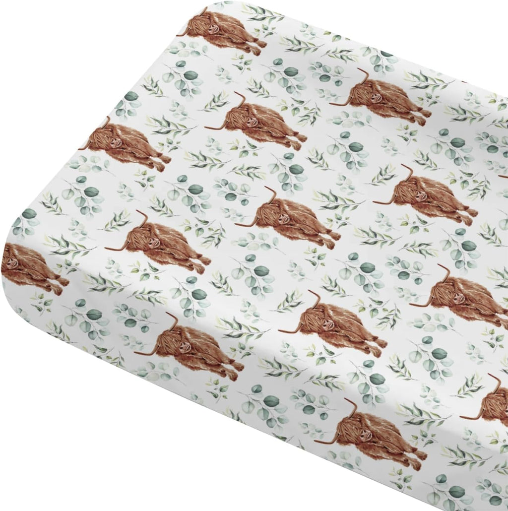 Tewrnvioc changing pad cover front view showing highland cow and eucalyptus print