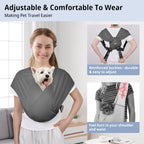 Small dog sitting securely in gray cotton sling