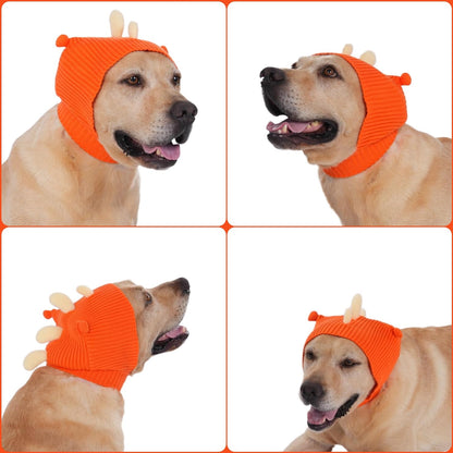 Side profile of medium dog wearing orange dinosaur dog snood