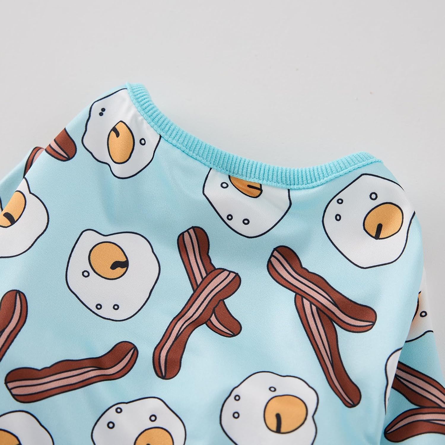 Close-up texture shot of the premium imported CozeVian polyester pet onesie material