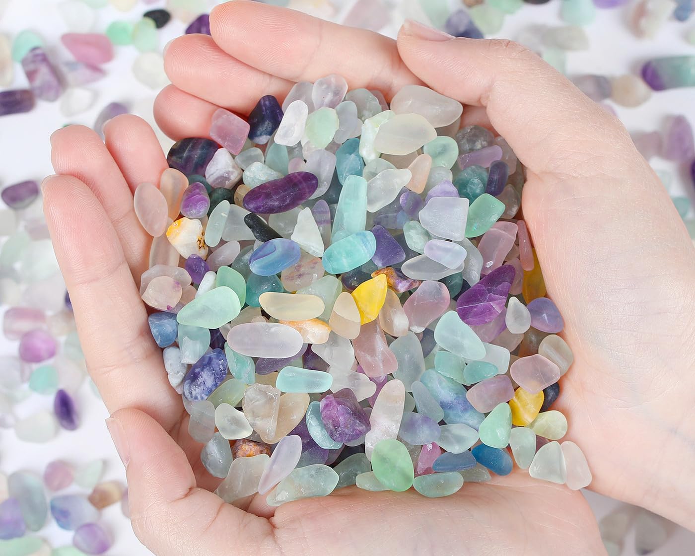 Qinjiejie Fluorite Aquarium Gravel rocks in a small glass container.