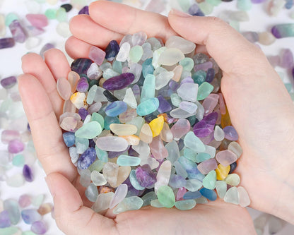 Qinjiejie Fluorite Aquarium Gravel rocks in a small glass container.