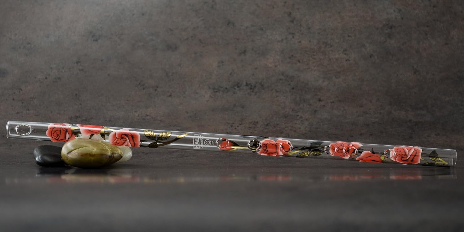 Handcrafted glass flute resting next to its dark green foam lined protective storage box
