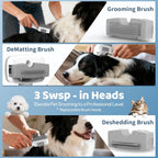 White compact pet grooming vacuum cleaner being emptied into a household dustbin