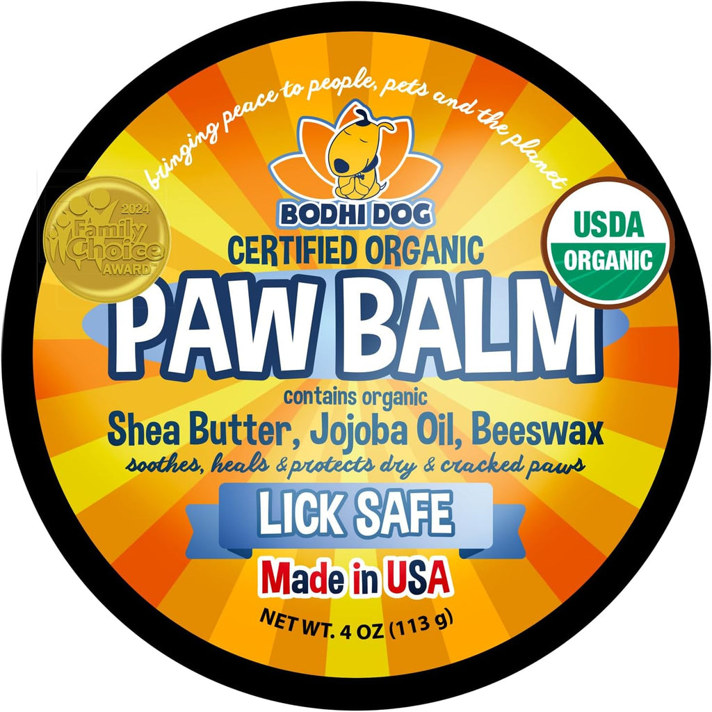 Pet owner applying soothing paw butter to dog paws