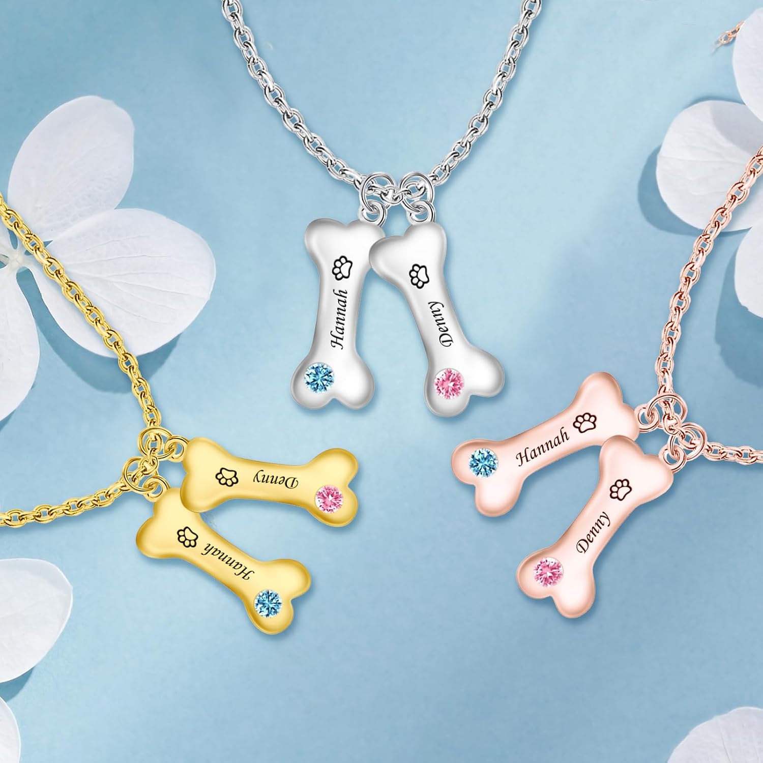 Close up angle of a customized pet memorial necklace featuring two distinct engraved names and colored crystals.