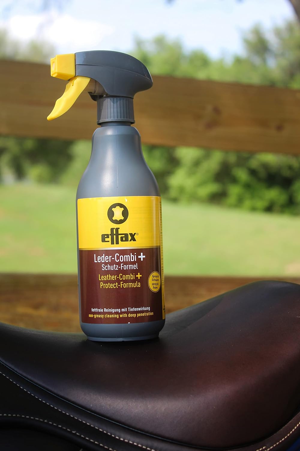 Equestrian grade leather cleaner spray being applied to premium leather equipment