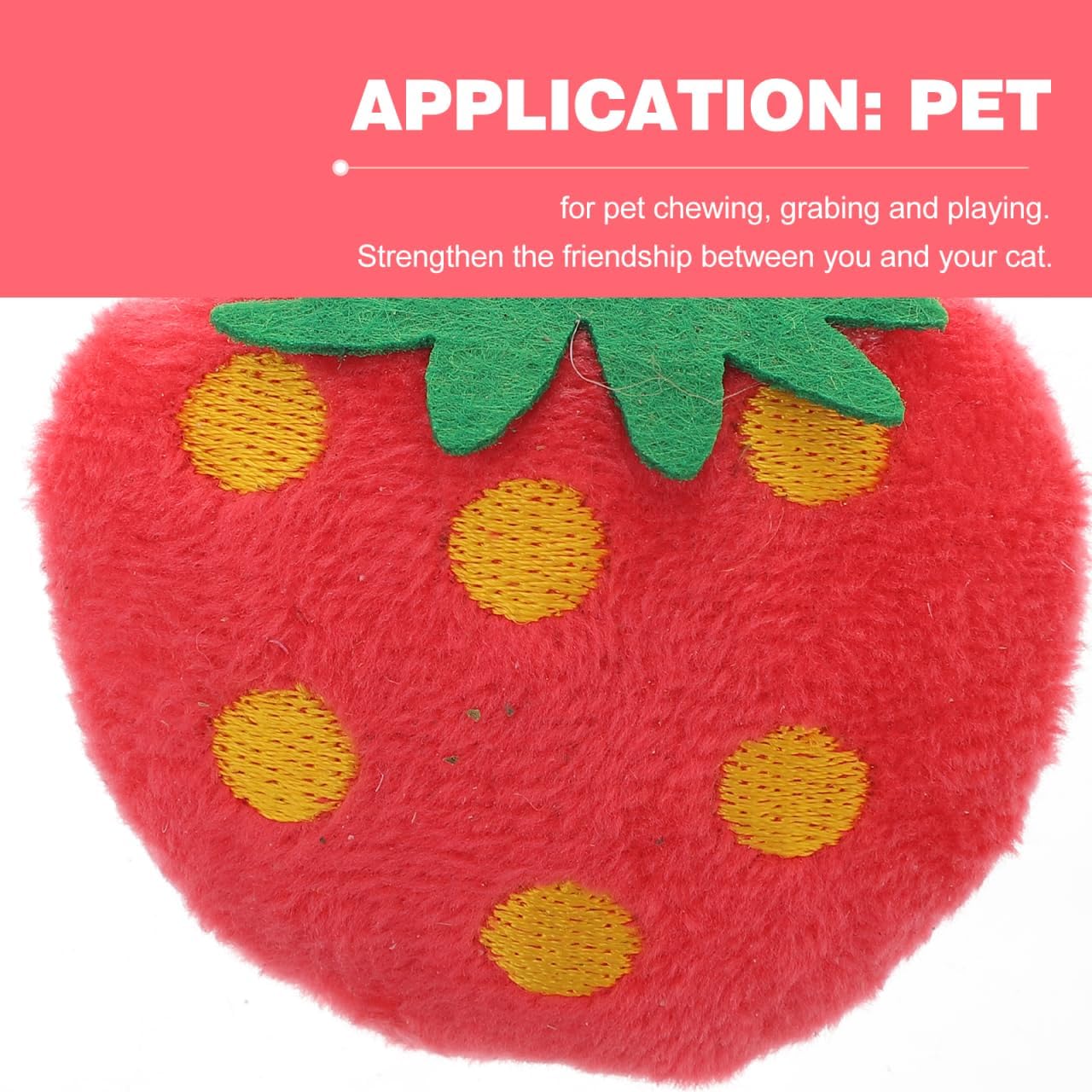 Close up of Toddmomy plush pet chew toy showing yellow dot embroidery and green leaf detail.