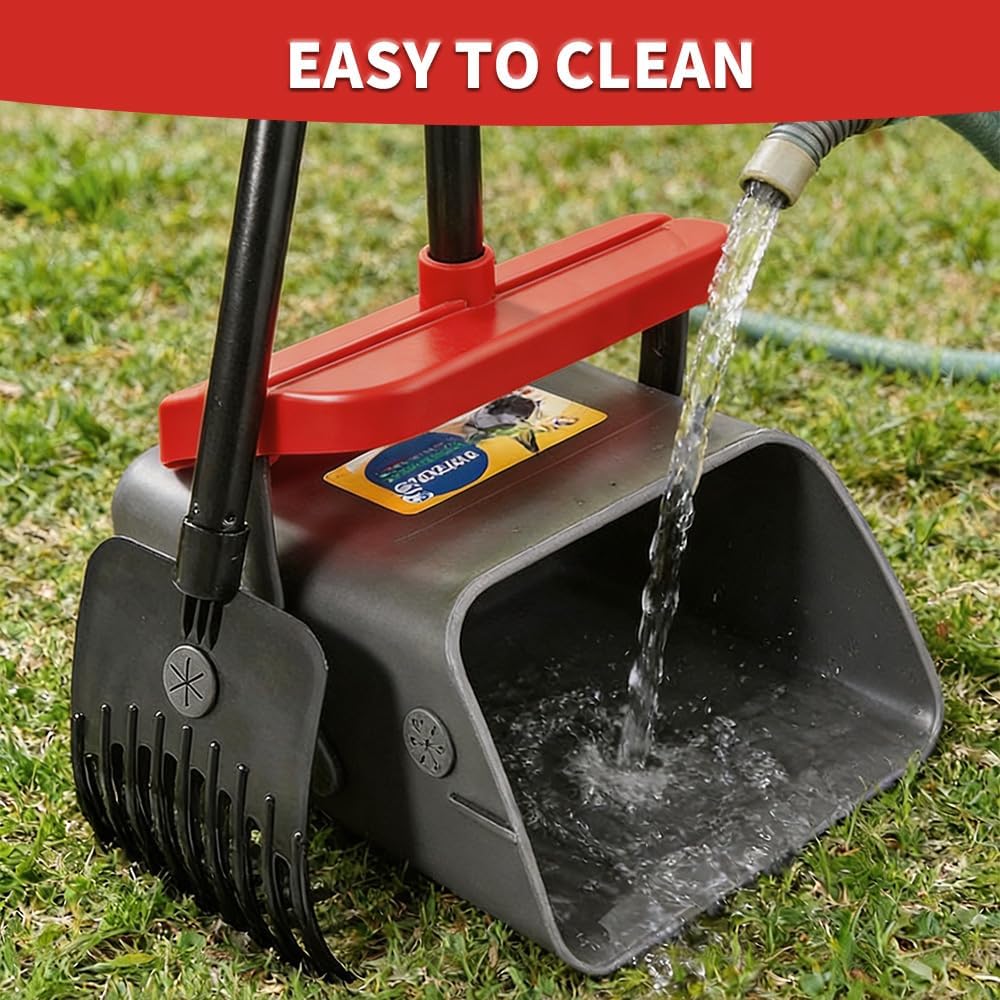 Heavy duty metal rake cleaning up yard debris and outdoor pet waste.