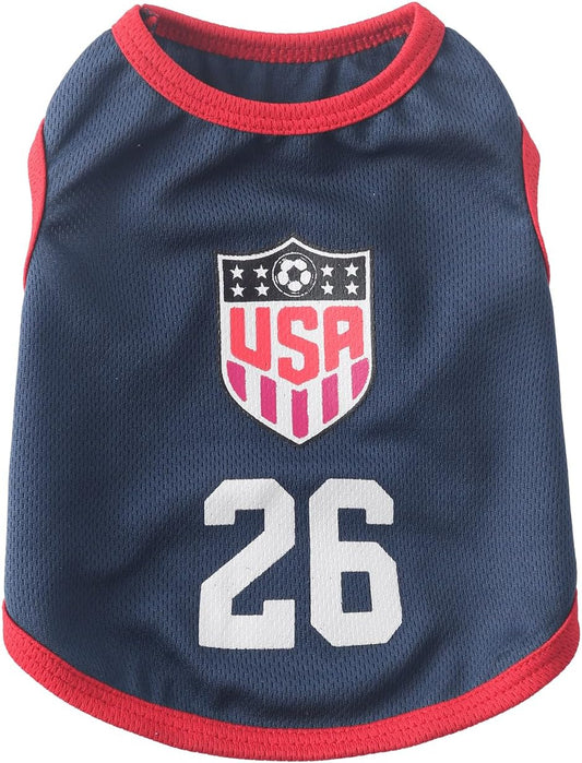 Small dog wearing USA soccer jersey athletic apparel
