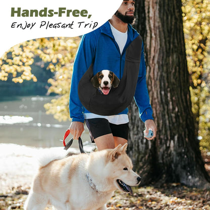 Small dog sitting inside Pawaboo black sling carrier